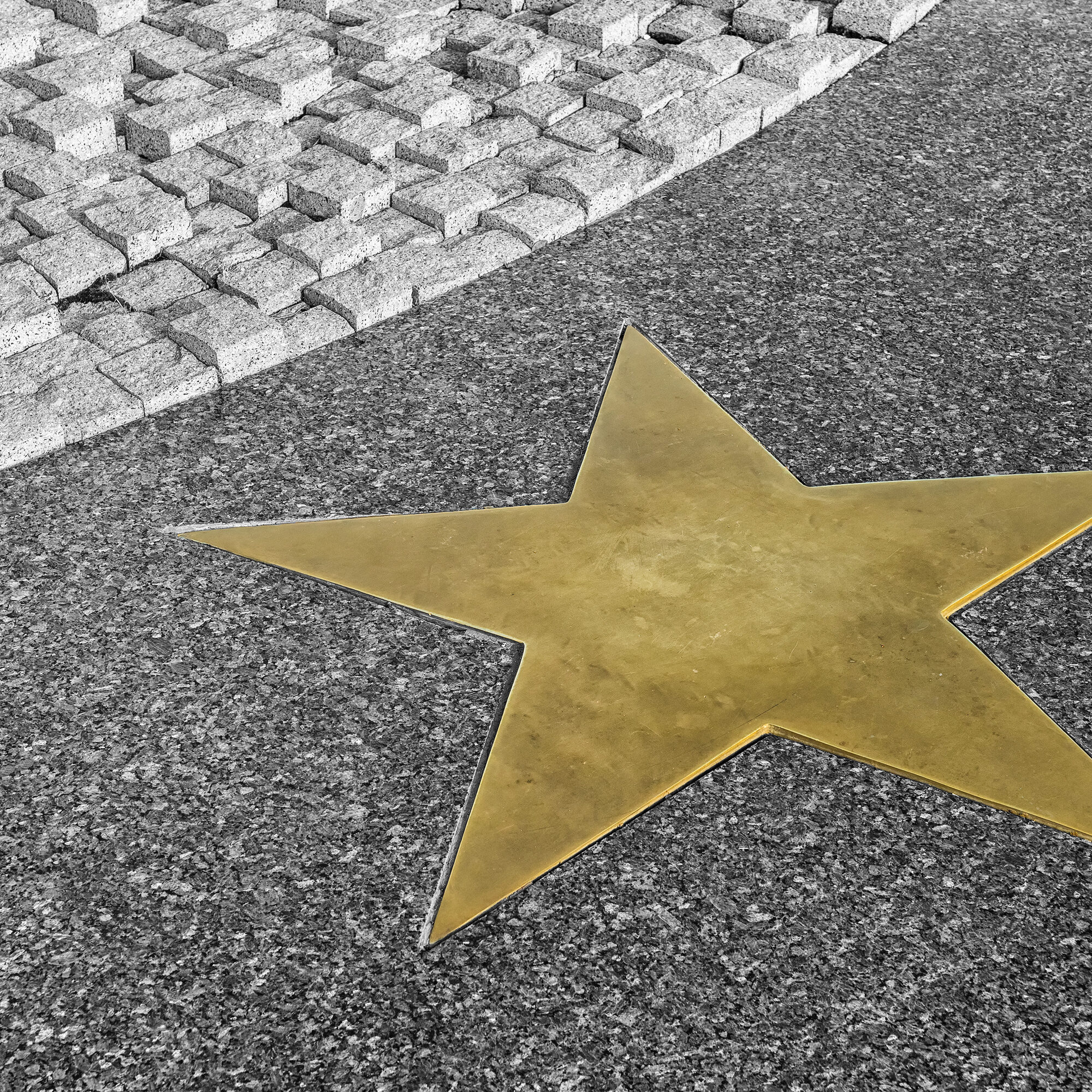 Bronze Star on the granite floor in black and white